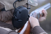 Load image into Gallery viewer, AKT1 Sport Electronic Earmuff, hearing protection for shooting sports, rubber control knob for easy volume adjustment, gun stock cut-out for shotguns, rifles, long guns, noise reduction rating, 25 NRR, impact noise blocking, safety