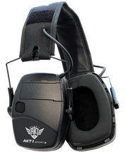 Load image into Gallery viewer, Black low-profile electronic ear muff with AKT1 Sport branding, designed for hearing enhancement and noise reduction.
